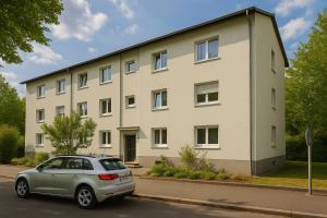 a car parked in front of a building at SMS-Homes I Auszeit in Heilbronn in Heilbronn