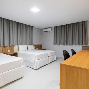 Postel nebo postele na pokoji v ubytování Hotel Solar Paulista + 37 fotografií