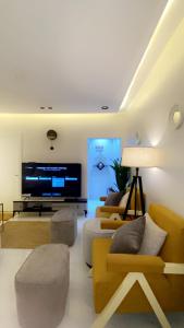 Μια τηλεόραση ή/και κέντρο ψυχαγωγίας στο فكرة سكن +7 φωτογραφίες