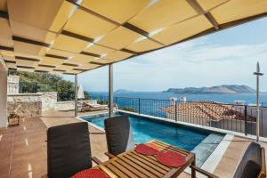 a house with a view of the ocean at Villa Pietroza in Kaş