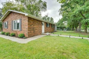 a small brick house with a grass yard at Cozy 3-Bedroom Home in Ann Arbor in Ann Arbor
