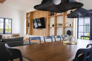 a dining room with a table and chairs at Parking Pool & Dock - Shellstone House in Key West +56 photos