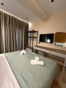 Postel nebo postele na pokoji v ubytování Afrimi Hotel