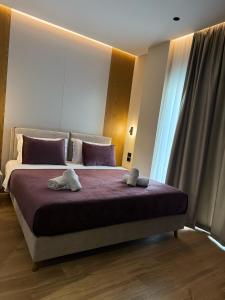 Postel nebo postele na pokoji v ubytování Afrimi Hotel