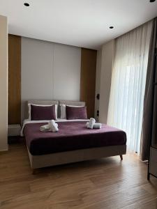 Postel nebo postele na pokoji v ubytování Afrimi Hotel