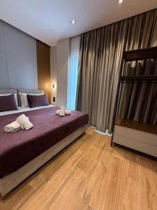 Postel nebo postele na pokoji v ubytování Afrimi Hotel