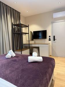 Postel nebo postele na pokoji v ubytování Afrimi Hotel