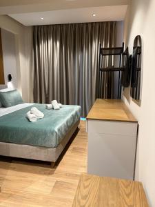 Postel nebo postele na pokoji v ubytování Afrimi Hotel