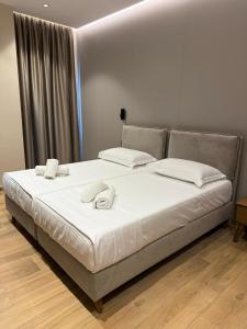 Postel nebo postele na pokoji v ubytování Afrimi Hotel