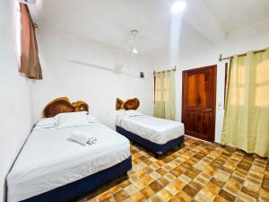 Postel nebo postele na pokoji v ubytování Hotel MB Bacalar