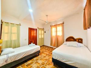Postel nebo postele na pokoji v ubytování Hotel MB Bacalar + 9 fotografií