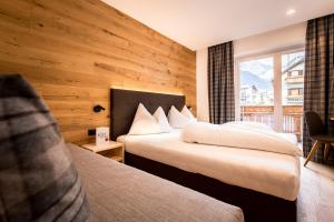 Postel nebo postele na pokoji v ubytování Hotel Antholzerhof + 37 fotografií