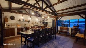 a kitchen with a table and chairs in a room at Villa Anna Salento in Presicce