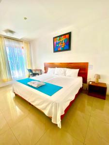Voodi või voodid majutusasutuse Galápagos Isabela Hotel Loja toas