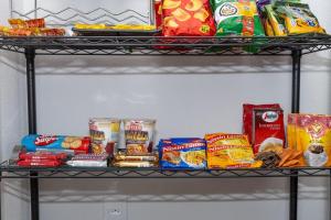 a shelf with various food items on it at Guaja 745 - Apartamento Luca in Belo Horizonte +11 photos