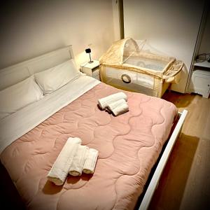 Postel nebo postele na pokoji v ubytování Conero Casa - Marcelli di Numana in Via Litoranea 101 sul mare vista Spiaggia con Parcheggio Esclusivo