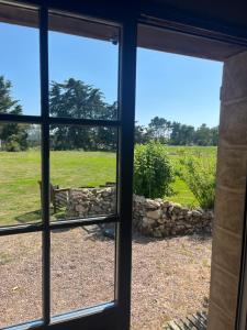a view from a window looking out at a field at Maison L union in Beauvoir-sur-Mer +7 photos