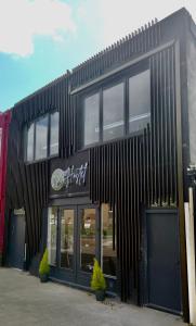 a black building with windows on the side of it at Y Hostel in Amsterdam +30 photos