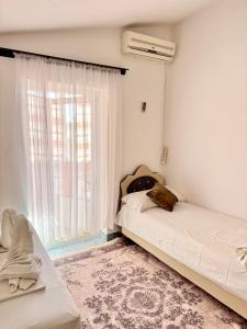 Postel nebo postele na pokoji v ubytování Apartments Zeneva