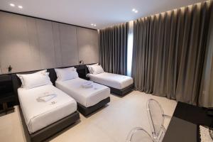 Postel nebo postele na pokoji v ubytování Hotel Majestic