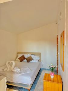 Postel nebo postele na pokoji v ubytování Apartments Zeneva