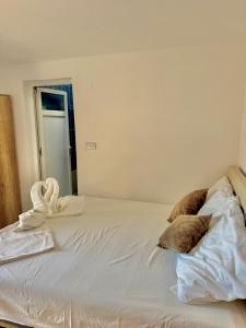 Postel nebo postele na pokoji v ubytování Apartments Zeneva