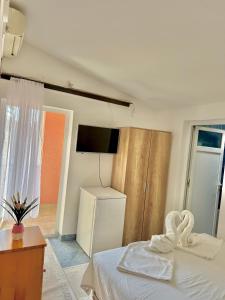 Postel nebo postele na pokoji v ubytování Apartments Zeneva