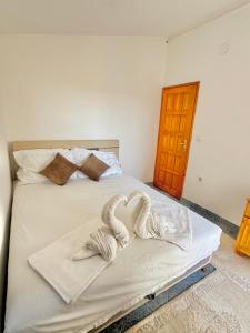 Postel nebo postele na pokoji v ubytování Apartments Zeneva