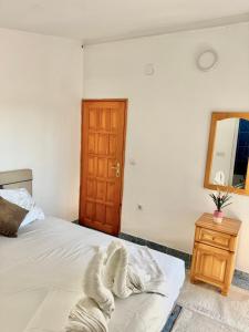 Postel nebo postele na pokoji v ubytování Apartments Zeneva