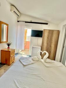 Postel nebo postele na pokoji v ubytování Apartments Zeneva