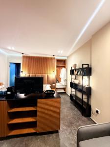 a room with a bedroom with a bed and a desk at Luna Mare Boutique Seaside in Borsh