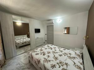 Ένα ή περισσότερα κρεβάτια σε δωμάτιο στο NIDO d'AMORE