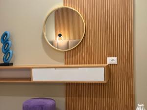 a mirror on the wall of a bathroom at Luna Mare Boutique Seaside in Borsh