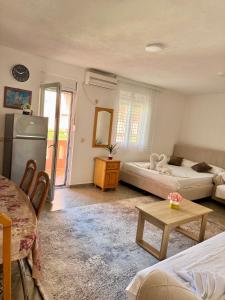 Postel nebo postele na pokoji v ubytování Apartments Zeneva