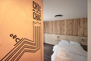 Ένα ή περισσότερα κρεβάτια σε δωμάτιο στο Motel Olympique 8 +1 φωτογραφίες