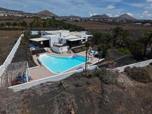 an aerial view of a house with a swimming pool at Villa Canto in Tías