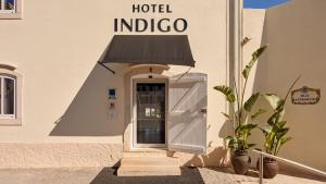 a hotel indico sign on the side of a building at Hotel Indigo Albufeira by IHG in Albufeira