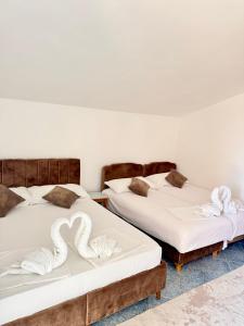 Postel nebo postele na pokoji v ubytování Apartments Zeneva