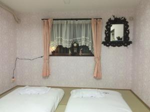 מיטה או מיטות בחדר ב-Guesthouse Siam