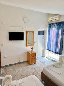 Postel nebo postele na pokoji v ubytování Apartments Zeneva