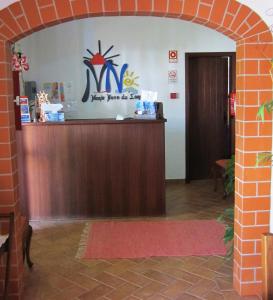 an entrance to a waiting room with a reception desk at Monte Novo da Longueira Turismo Rural in Longueira