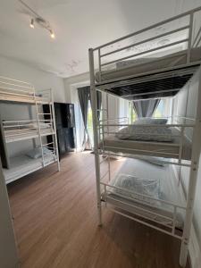 a bedroom with two bunk beds in a room at Bagetti hostel only for girls in Lisbon
