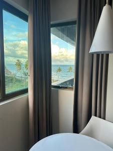 Giường trong phòng chung tại Ritz Suítes Beira-Mar 522 +35 ảnh