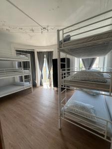 a bedroom with two bunk beds in a room at Bagetti hostel only for girls in Lisbon