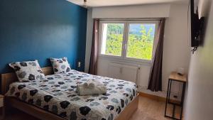Postel nebo postele na pokoji v ubytování Appart'Hotel Lizon Cocooning avec sauna