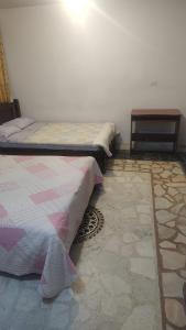 Postel nebo postele na pokoji v ubytování Hotel Preludio