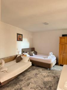 Postel nebo postele na pokoji v ubytování Apartments Zeneva