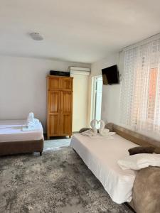 Postel nebo postele na pokoji v ubytování Apartments Zeneva