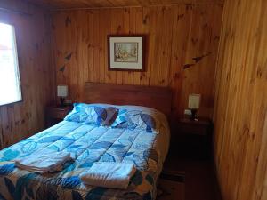 Postel nebo postele na pokoji v ubytování Refugio Natural Pucón