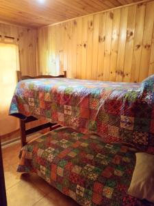 Postel nebo postele na pokoji v ubytování Refugio Natural Pucón